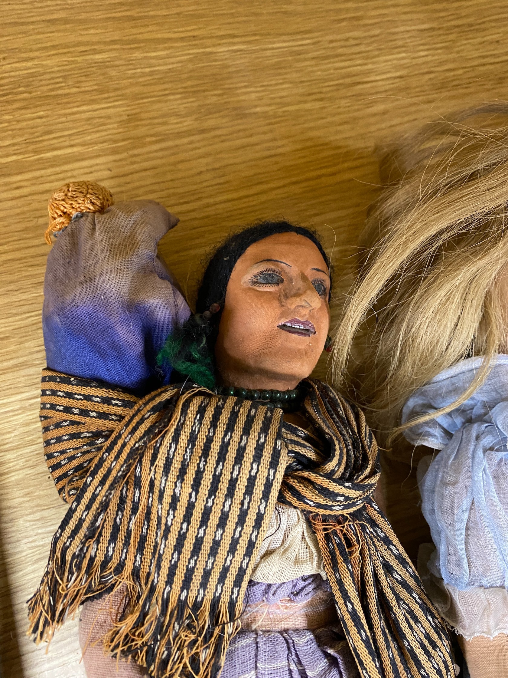 A Farnell’s Alpha Toys felt doll, 46cm, three Mexican souvenir cloth dolls and various clay toy dishes